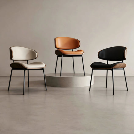 Puwabi KY-005 curved back upholstered dining chairs with cushioned seats, arranged in a modern dining room setting.