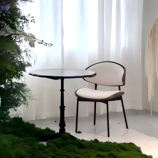 Side profile of the Puwabi KY-005 armchair with sweeping wood armrests and thick seat cushion, engineered to commercial grade for restaurant dining chairs wholesale.
