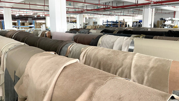 Row of upholstered chairs in a warehouse setting