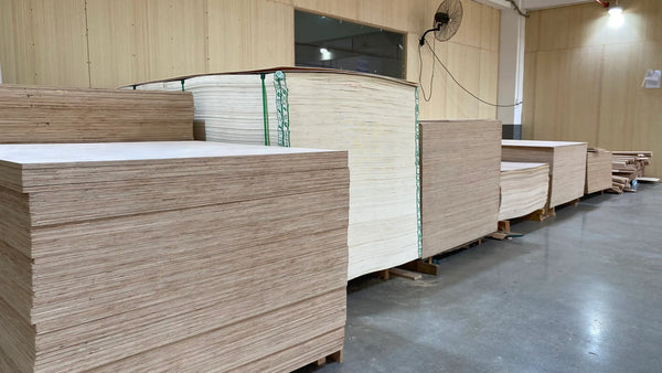 Stacks of wooden panels in a warehouse setting