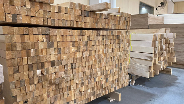 Stacks of wooden planks in a warehouse setting