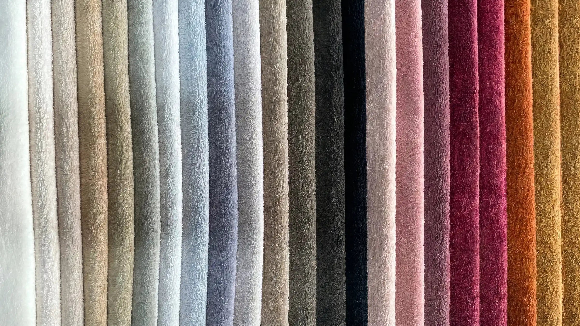 Row of textured fabric swatches in various colors.