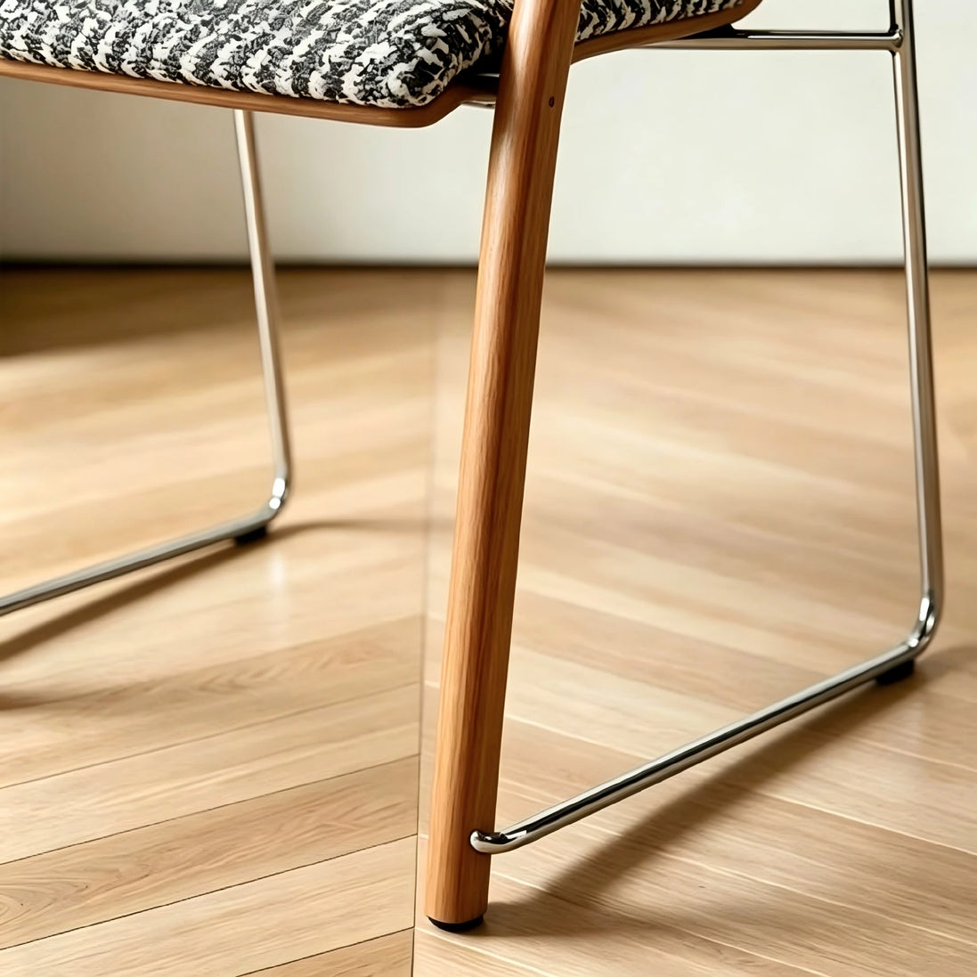 Puwabi X6209 solid ash and stainless steel dining armchair with a modern design, shown from the front side.