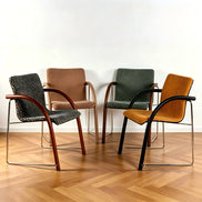 Puwabi X6209 solid ash and stainless steel dining armchair with sleek design and cushioned seat for contract dining spaces