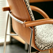 Puwabi X6209 solid ash and stainless steel dining armchair with cushioned seat, modern design, shown from side angle.