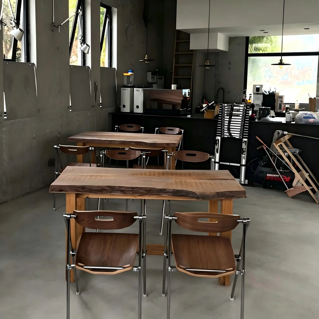 Puwabi X6198 architectural folding dining chair with wooden frame and cushioned seat, arranged in a modern dining setting