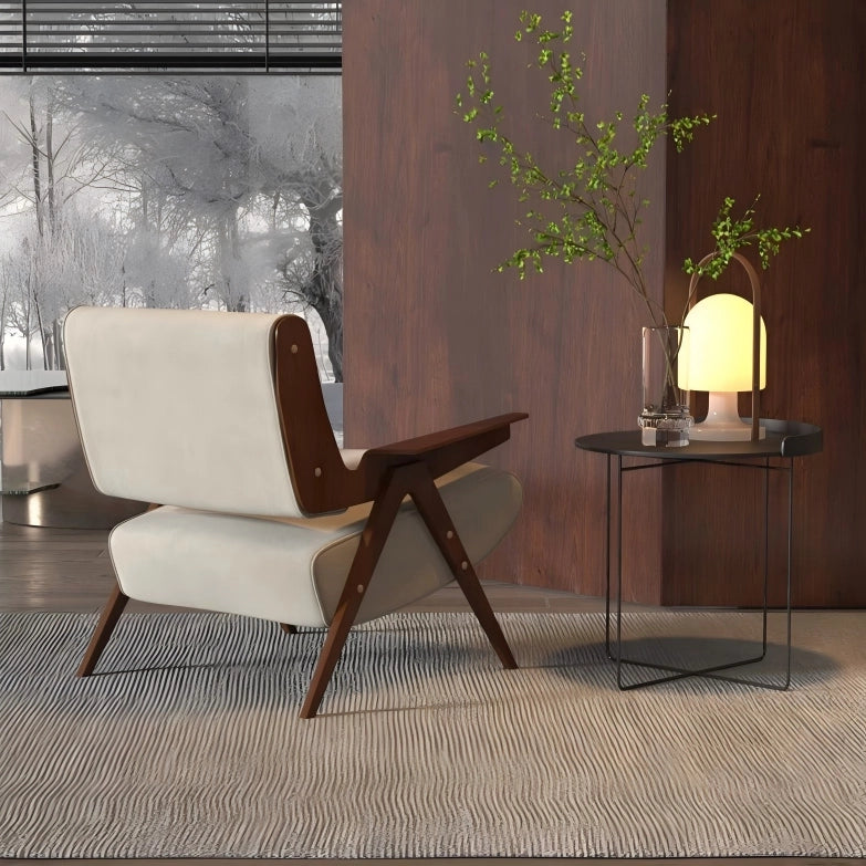 Modern chair with wooden armrests and white seat in a room with a side table and lamp.