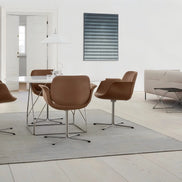 Puwabi X6049 sculptural leisure chair with modern design and smooth curves, showcased in a contemporary setting.