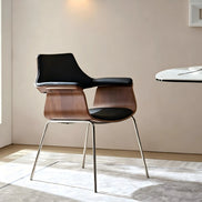 Puwabi X6119 sculptural bentwood contract dining armchair with curved wooden frame and padded seat, designed for commercial dining spaces.